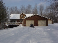 A view of  the south end of 13th Fairway Vacation Home during the winter.