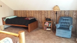 Twin bed in upper level bedroom.